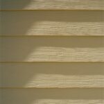 Close detail of painted engineered wood siding